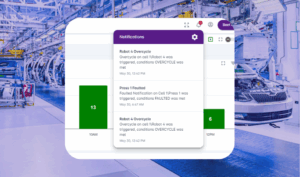 BEET Platform showing live alert notifications—Cycle Time Exceeded and Press Faulted—over a modern automotive assembly line with visible robotics and vehicle frames.
